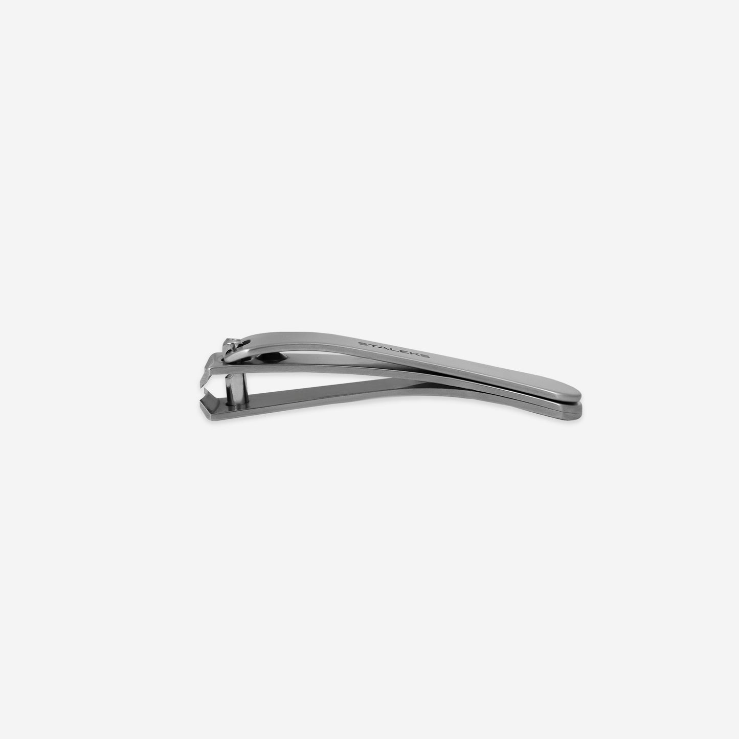 The STALEKS Nail Clipper Small BEAUTY & CARE 10 by Staleks is displayed against a plain white background. Slightly open, it highlights its sharp, stainless steel cutting edges and sleek, compact metallic design.