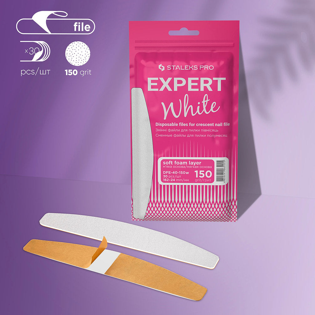 A pink package of StALEKS PRO Disposable White Files for Crescent Nail File on a Soft Foam Layer EXPERT 40 (30 pcs) is shown with three white 100 grit crescent files and orange backing, set against a purple background.