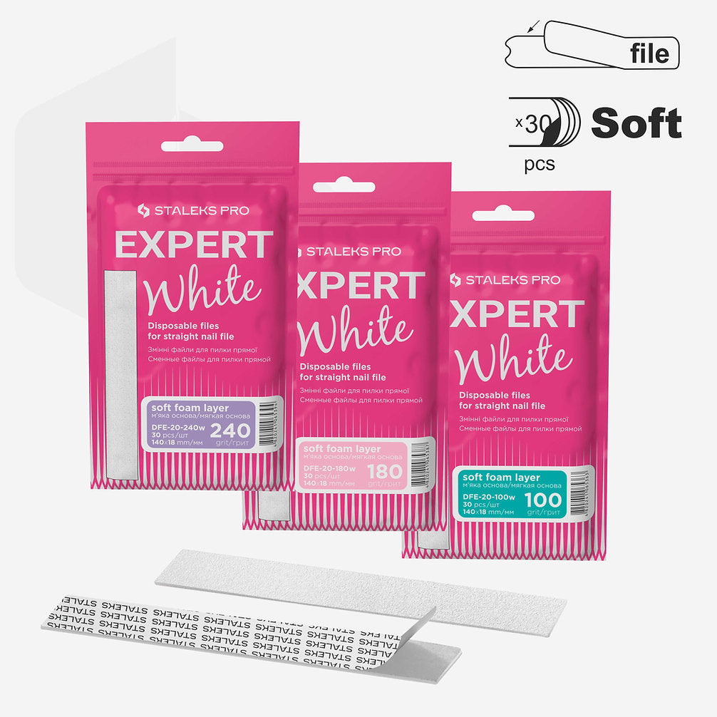 Three packs of Staleks PRO Expert 20 Disposable White Files (100, 180, 240 grit) on soft foam layers in pink packaging. Each pack has 30 adhesive-backed nail file strips by Staleks.