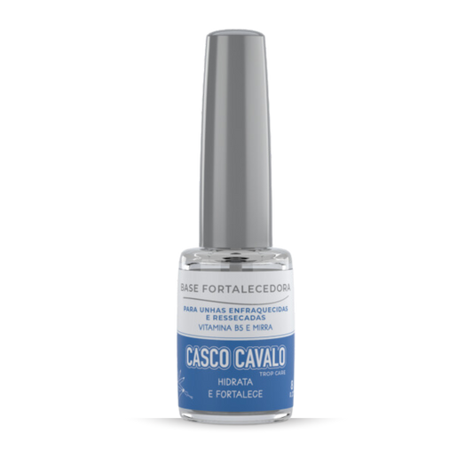 A clear nail polish bottle with a silver cap is labeled "TROP CARE Casco De Cavalo." The packaging describes it as a strengthening base for weak and dry nails, enriched with Vitamin B5 and Myrrh Oil, with the text in Portuguese.