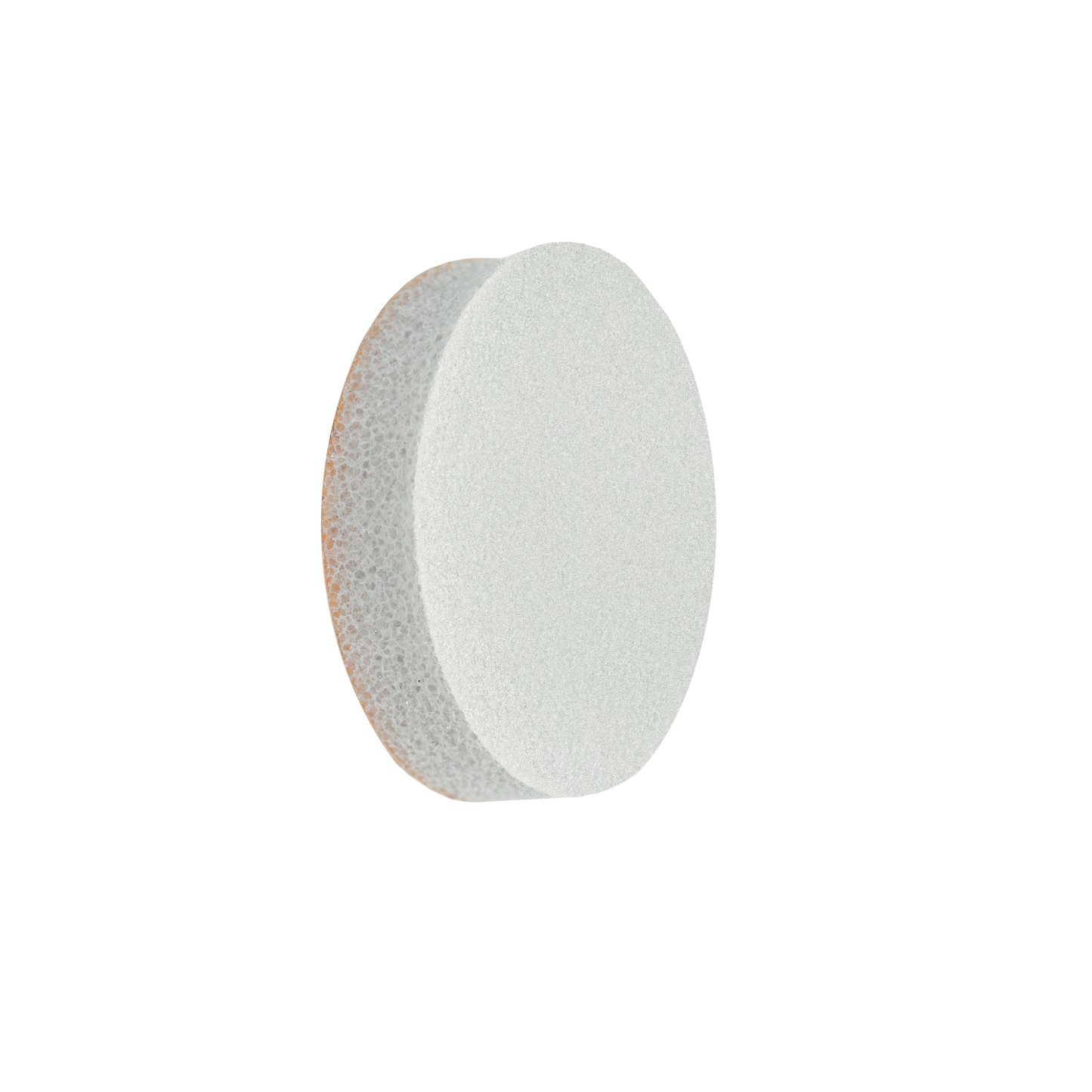 A white, round STALEKS PRO Disposable File-Sponge for Pedicure Disc PODODISC L EXPERT 25 by Staleks is shown against a black background, its spongy texture and abrasive surface highlighted by lighting from the right.