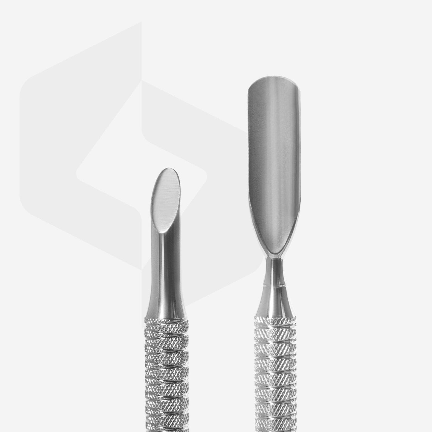 Two Staleks stainless steel cuticle pushers with textured handles displayed against a white background with a transparent star-shaped watermark.