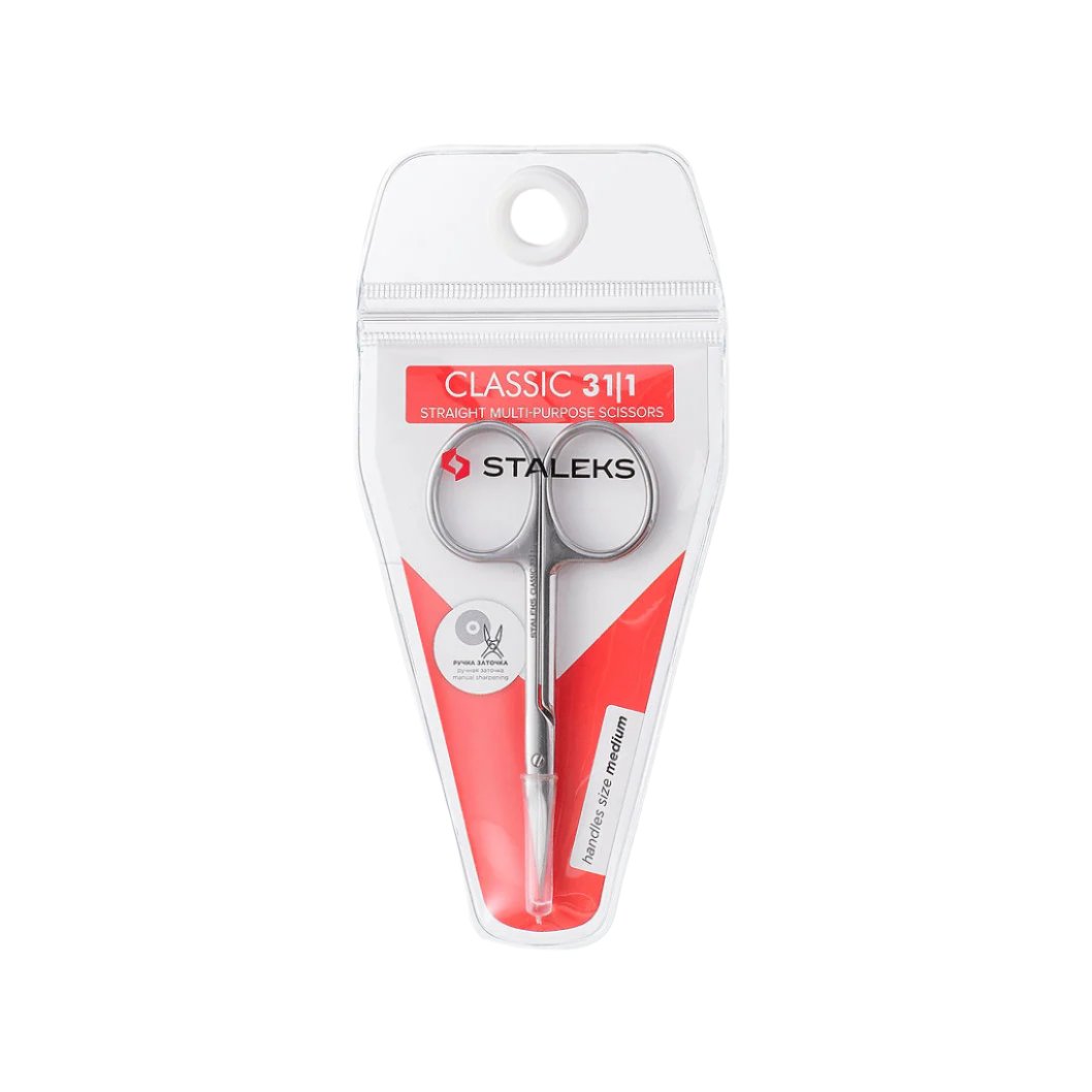 The STALEKS PRO Straight Multipurpose Scissors CLASSIC 31 TYPE 1 by Staleks feature sharp blades, a silver handle, and come in a clear case with red and white branding, "CLASSIC 31/1" label, and a hanging hole at the top.