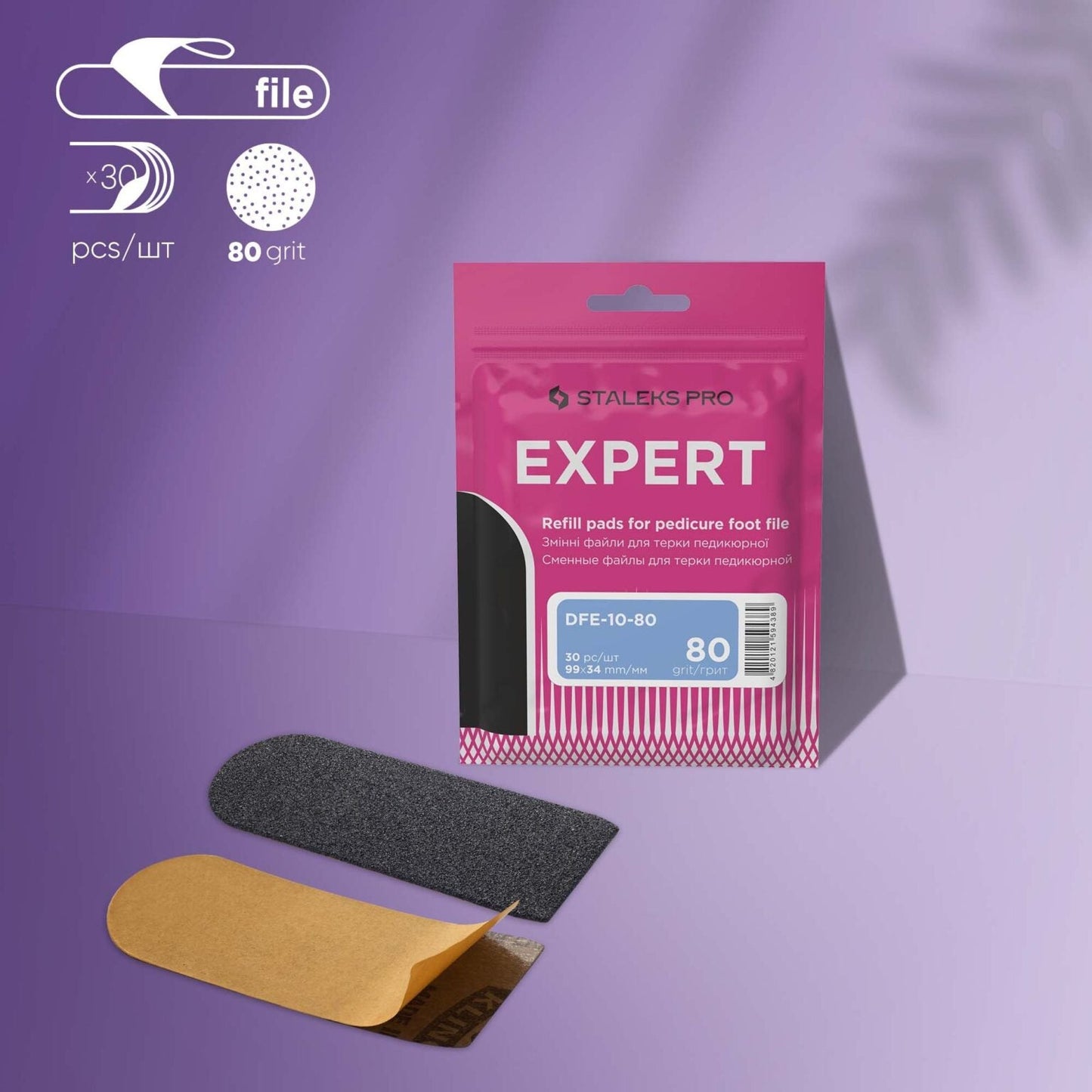 A pink "EXPERT 10" package labeled Staleks holds 30 disposable pedicure grater files (80 grit). Two refill pads, one black and one brown, are shown below on a purple background with shadow patterns.