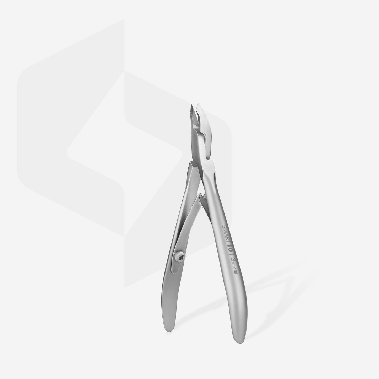 The STALEKS PRO SMART 10 cuticle nippers by Staleks feature a sleek stainless steel design and 3 mm jaw, standing elegantly against a light gray backdrop for precise grooming.