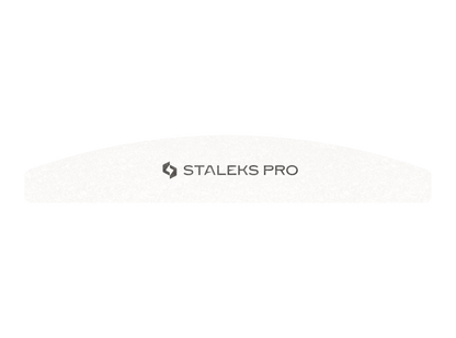The STALEKS PRO Grinding Buff crescent EXPERT 41, a white curved nail file (100/180 grit) with "STALEKS PRO" branding, features straight bottom and rounded top edges—ideal for shaping artificial nails. Sold in packs of 10. Brand: Staleks.