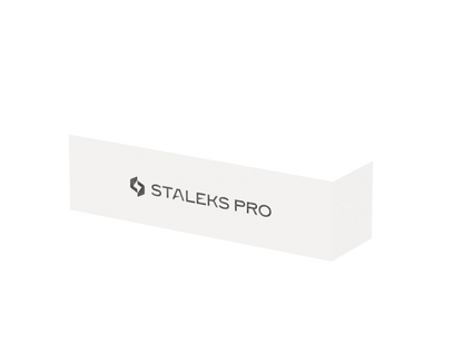 The STALEKS PRO Grinding Buff Rectangular EXPERT 51 150 grit (10 pcs) by Staleks is a white buffer block with the black "STALEKS PRO" logo, ideal for smoothing artificial nails or prepping for nail extensions.