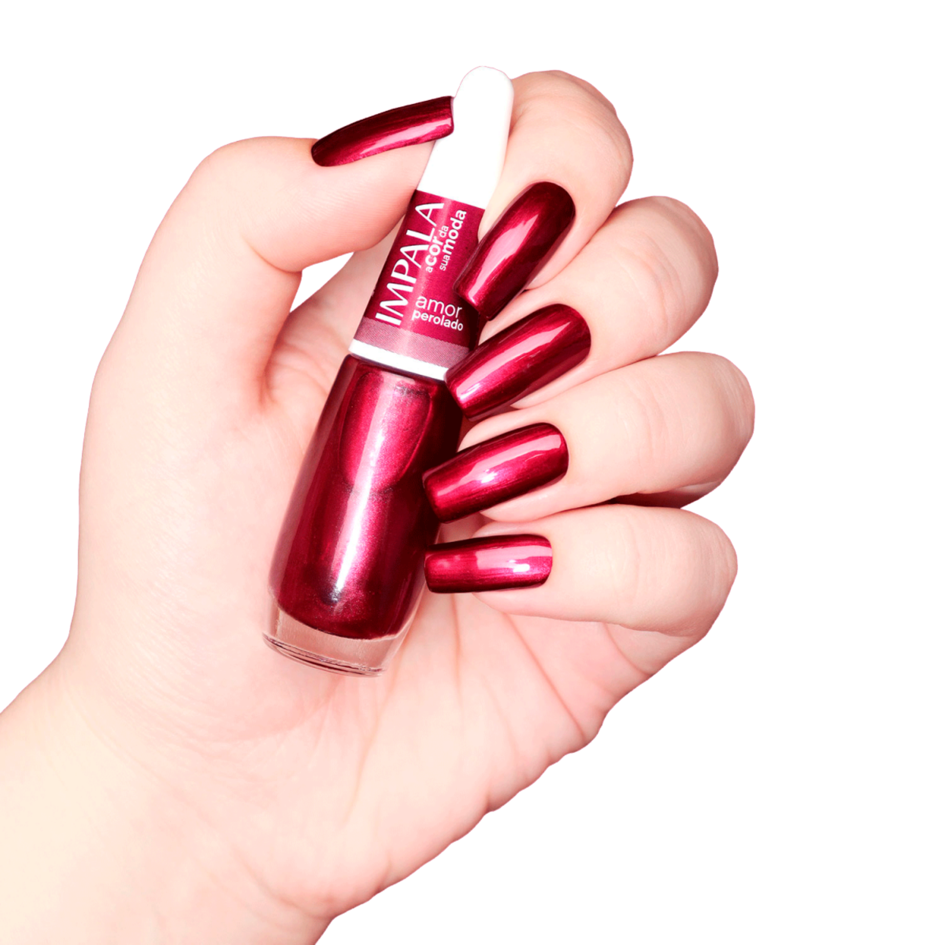 A hand with long, shiny, metallic red nails holds an Impala Regular Nail Polish Pearlescent Red Amor Perolado 7.5 ml bottle against a white background.