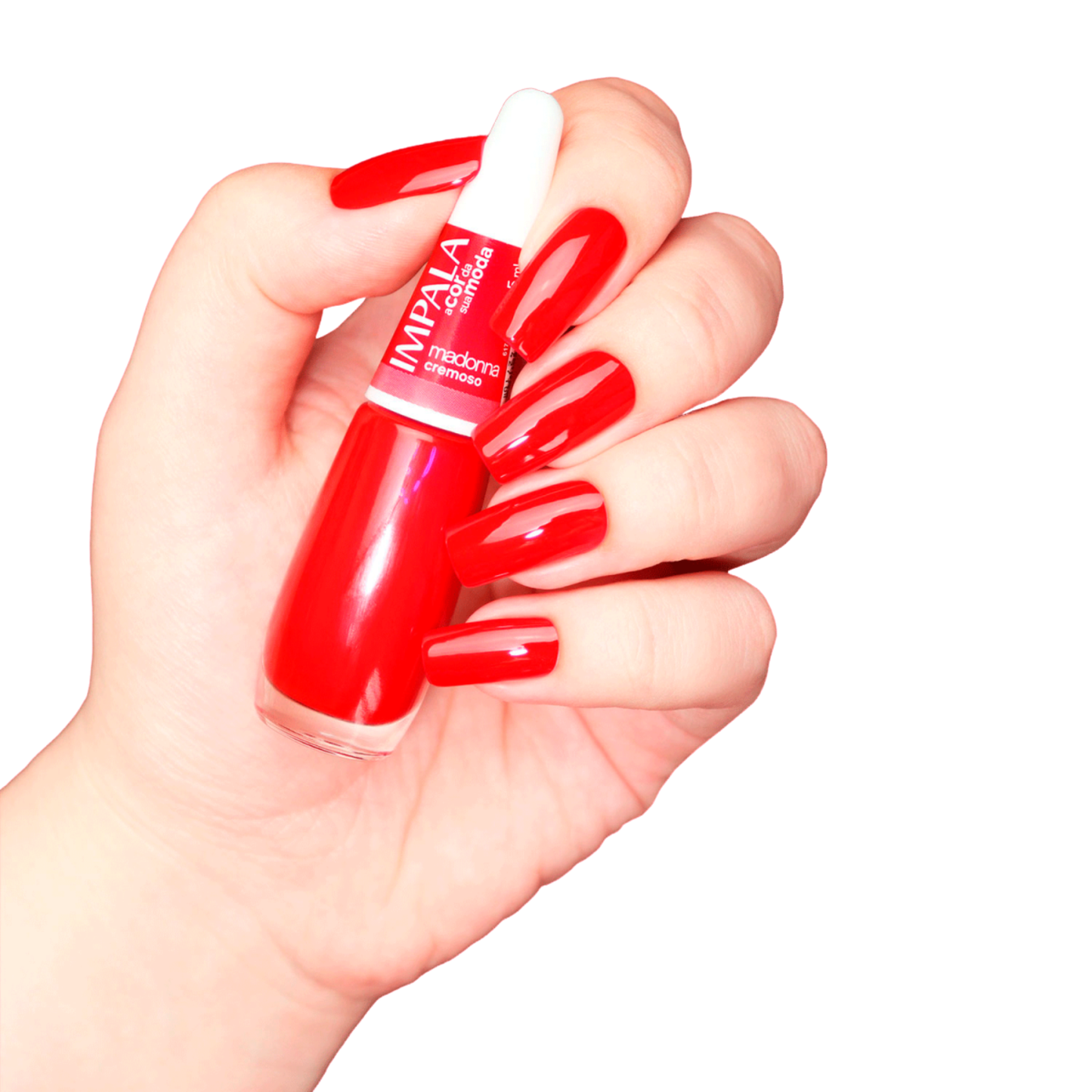 A hand with long, shiny red nails holds a 7.5 ml bottle of IMPALA Regular Nail Polish Creamy Ruby Red Madonna with a white cap by Impala against a white background.