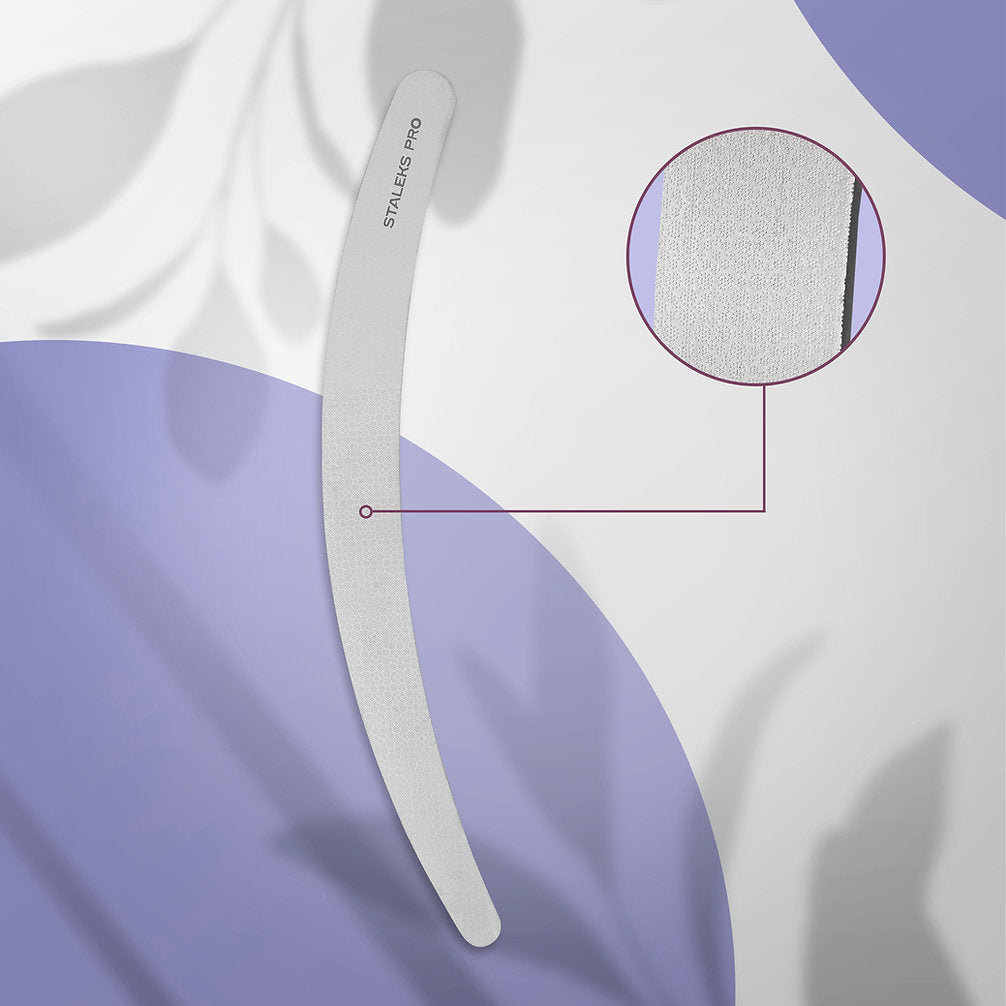 The STALEKS PRO Laser Nail File EXPERT 10 170 mm (Curved) by Staleks is a gray stainless steel file, shown on a purple and white background with shadows. A circular inset highlights its textured surface and long-lasting durability.