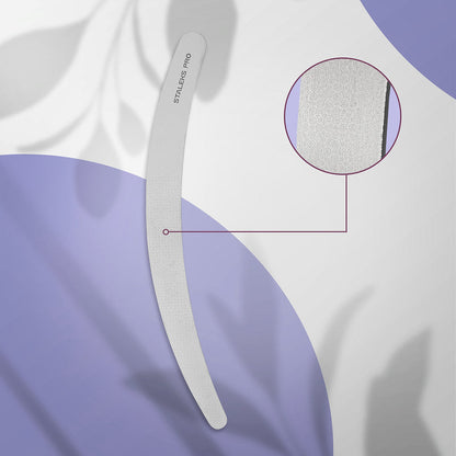 The STALEKS PRO Laser Nail File EXPERT 10 170 mm (Curved) by Staleks is a gray stainless steel file, shown on a purple and white background with shadows. A circular inset highlights its textured surface and long-lasting durability.