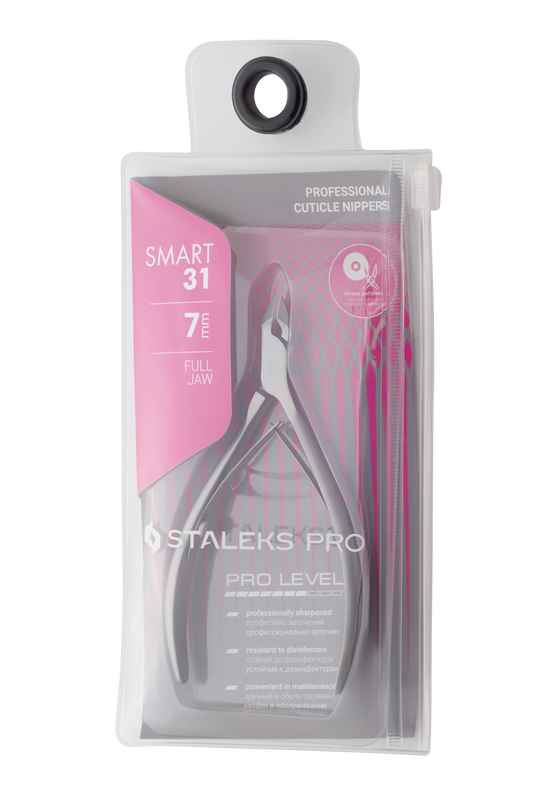 The image shows a package of STALEKS PRO Professional Cuticle Nippers, SMART 31 model, featuring a 7 mm jaw. Crafted from durable stainless steel, the packaging displays pink and white text highlighting its manual sharpening and disinfector resistance.