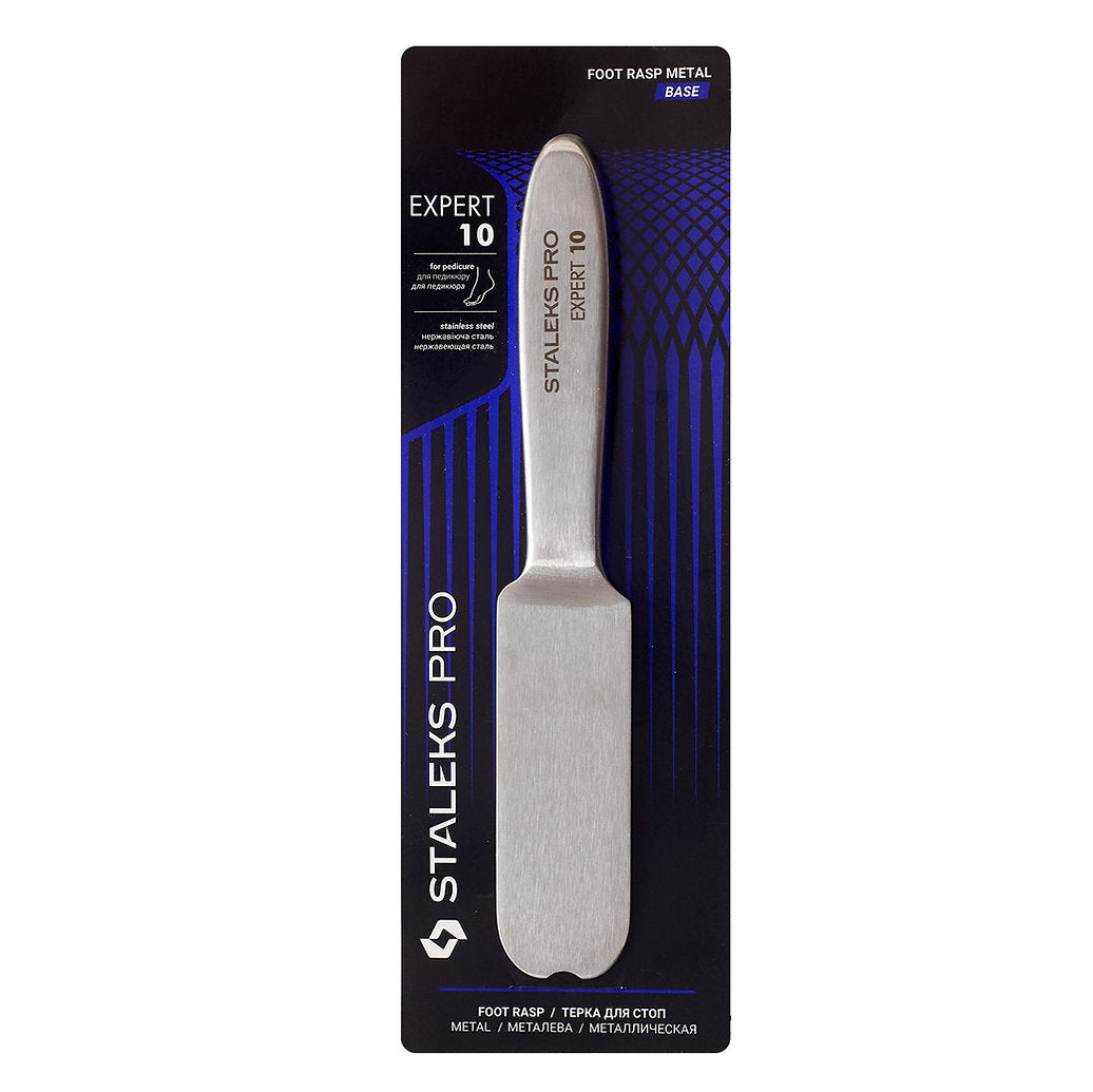 The STALEKS PRO Metal Base for Pedicure Grater EXPERT 10 by Staleks is shown in black and blue packaging, displaying the full rectangular abrasive surface, handle, and clear product branding and description.