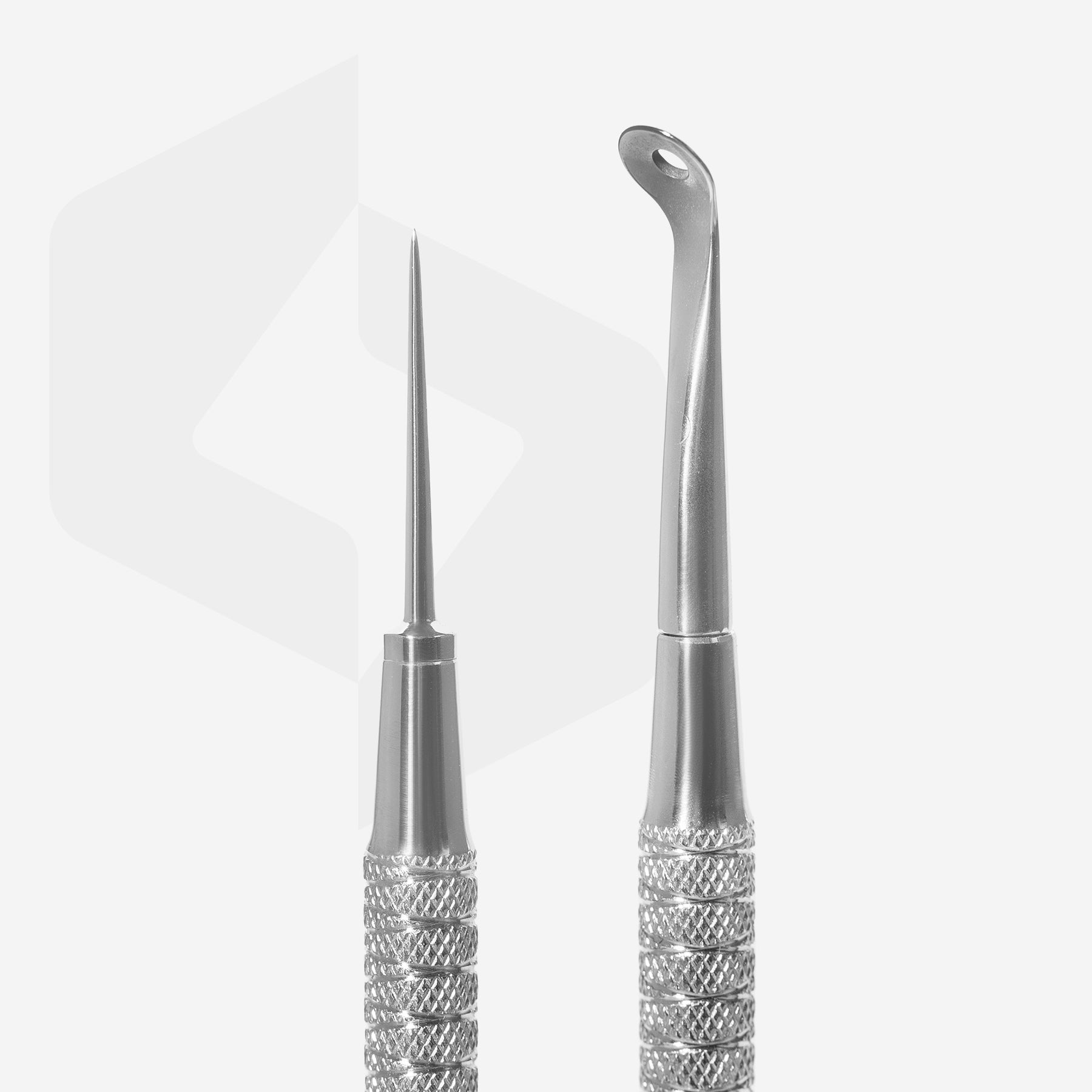 Two Staleks PRO Beauty care double-ended tools (UNO small and Vidal needle straight) EXPERT 21 TYPE 4 crafted from AISI 420 stainless steel with metal handles and pointed tips are shown on a light, reflective background, highlighting their precision design.