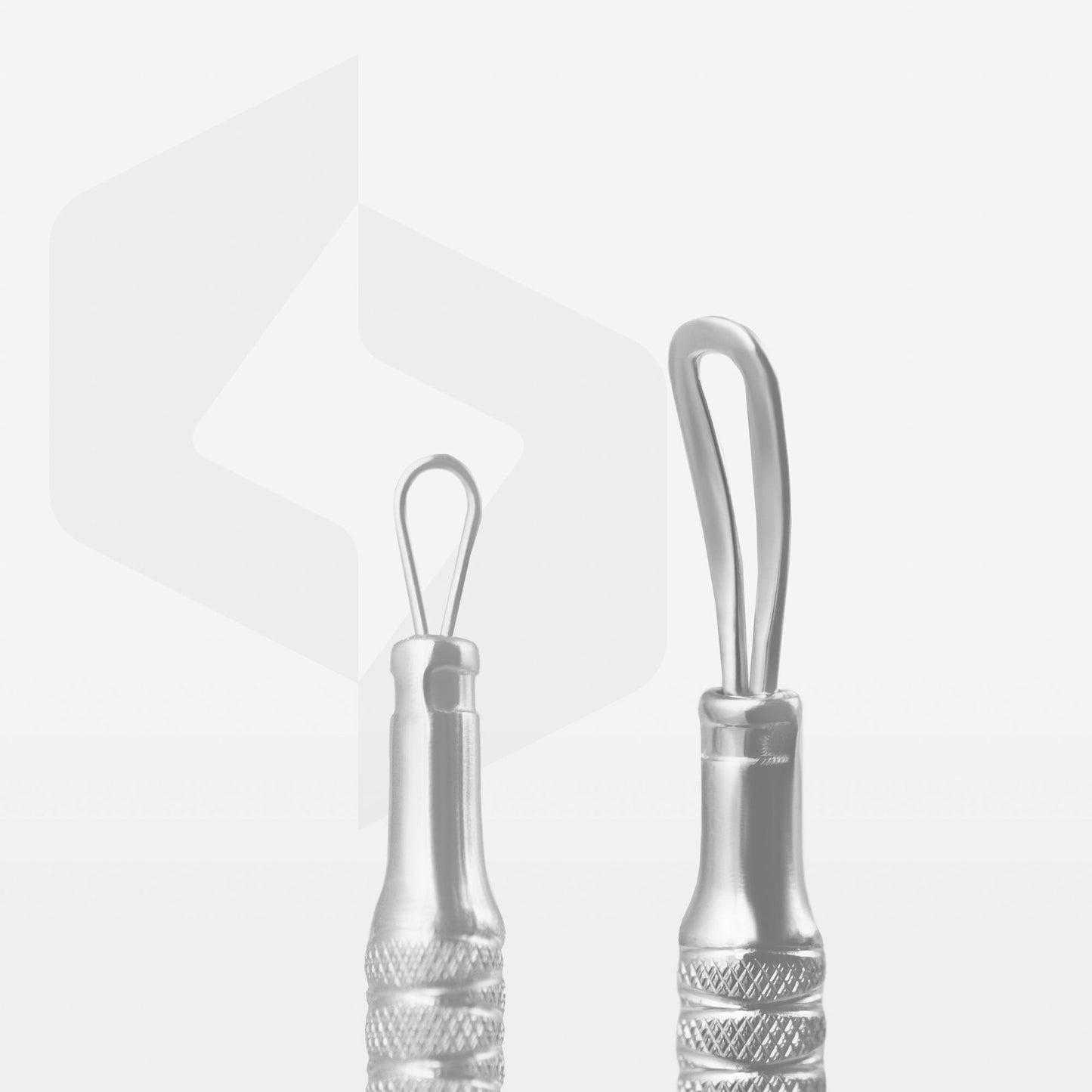 Two STALEKS PRO Beauty care Blackhead Remover double-ended tools with 2 loops against a white background with a faint shadow and a reflective surface. The logo in the background suggests a focus on fashion or branding.