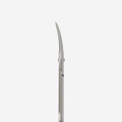 The image features a detailed view of the STALEKS PRO Asymmetric Professional Cuticle Scissors UNIQ 20 TYPE 4 by Staleks, showcasing its ergonomic and sleek silver design. The slightly curved blades emphasize their precision, while the reflective handle adds an elegant touch against a white background.