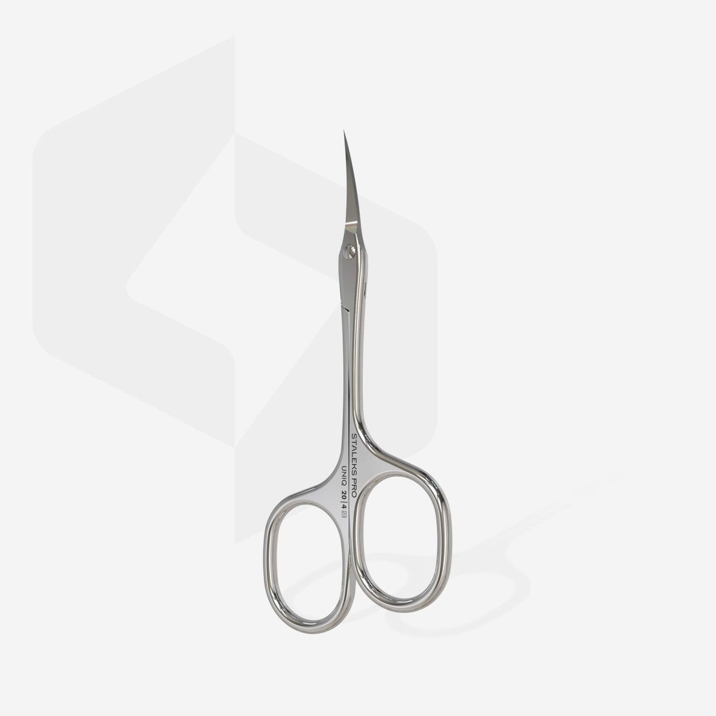 The STALEKS PRO Asymmetric Professional Cuticle Scissors UNIQ 20 TYPE 4, crafted by Staleks, are sleek silver scissors with curved, pointed blades. Designed with ergonomic asymmetric rings, these professional tools are displayed upright against a plain white background featuring a subtle geometric pattern on the left side.