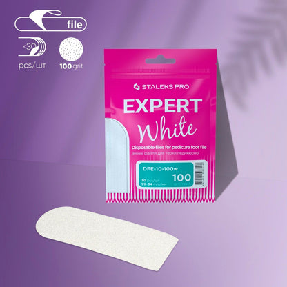 STALEKS PRO Refill Pads for Pedicure Foot File Expert 10 (100 grit, 30 pcs) by Staleks shown in white packaging, with a single white foot file in front on a light purple background with soft shadows.