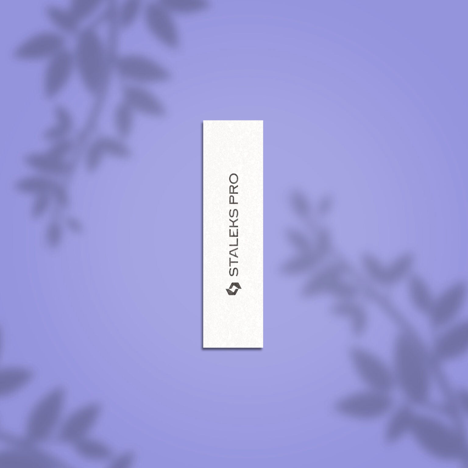 A white rectangular STALEKS PRO Grinding Buff EXPERT 51 150 grit nail file (10 pcs) with black vertical branding, displayed on a soft purple background with subtle blurred leaf shadows in the corners.