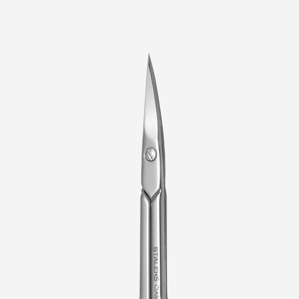 The STALEKS PRO Cuticle Scissors CLASSIC 21 TYPE 1 by Staleks feature sharp, curved stainless steel blades for precision manicures and pedicures, displayed on a plain white background.