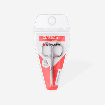 The STALEKS PRO Cuticle Scissors CLASSIC 21 TYPE 1 by Staleks come in clear plastic packaging with a red and white design, featuring precision icons—ideal for manicures and pedicures.