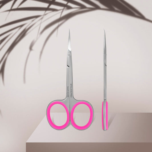 Staleks STALEKS PRO Professional Cuticle Scissors With Hook SMART 41 TYPE 3, featuring silver blades and pink handles with a curved hook design, are displayed front and side on a beige surface with a soft plant shadow in the background.