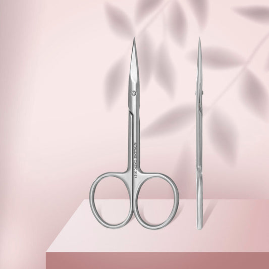 The STALEKS PRO Straight Multipurpose Scissors CLASSIC 31 TYPE 1 by Staleks are displayed upright and in profile on a pink surface with soft leaf shadows in the background.