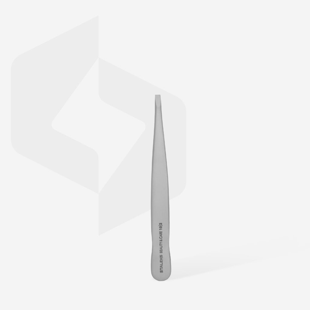 A single STALEKS PRO Eyebrow Tweezers Beauty & Care 10 Type 2 by Staleks stands upright on a plain white background, featuring engraved text on the handle. Its slant-tip design ensures precision, perfect for shaping thick eyebrows.