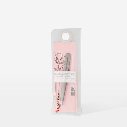The STALEKS PRO Eyebrow Tweezers BEAUTY & CARE 10 TYPE 3 (wide beveled) come in a pink and transparent floral case, ideal for shaping thick brows. Includes a circular hole at the top for hanging display. Brand: Staleks.