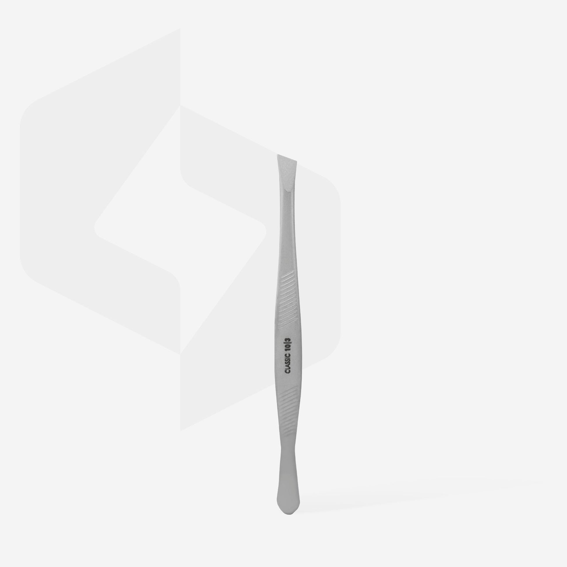 A stainless steel cuticle pusher with a textured grip stands upright on a white background, featuring flat angled and rounded tips—perfect for use with Staleks STALEKS PRO Eyebrow Tweezers CLASSIC 10 TYPE 3 (wide beveled) when grooming thick brows.