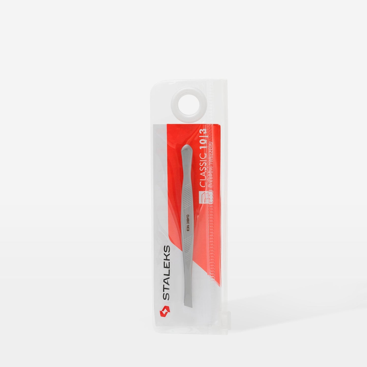 A pair of stainless steel Staleks PRO Eyebrow Tweezers CLASSIC 10 TYPE 3 (wide beveled) in clear plastic and red packaging, designed for shaping thick eyebrows, stands upright on a white background.