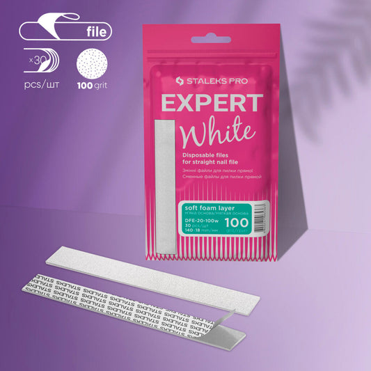 A pink package labeled "Staleks PRO Disposable White Files For Straight Nail File on Soft Foam Layer EXPERT 20 (30 pcs)" is displayed on purple. Two silver adhesive-backed nail files, one flipped to show text, are in front.